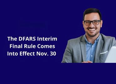 A male business professional, smiling at the camera and shown from the chest up, with the copy The DFARS Interim Final Rule Comes Into Effect Nov. 30 to the left.