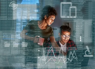 A man and woman working in a dark space, illuminated by a computer screen as they look at data. An overlay of code, charts, and data surround them both on the image.