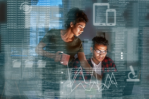 A man and woman working in a dark space, illuminated by a computer screen as they look at data. An overlay of code, charts, and data surround them both on the image.